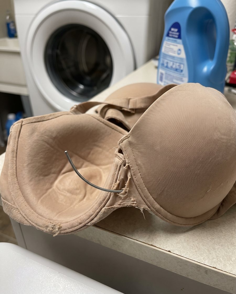An underwire poking out of the bra after washing