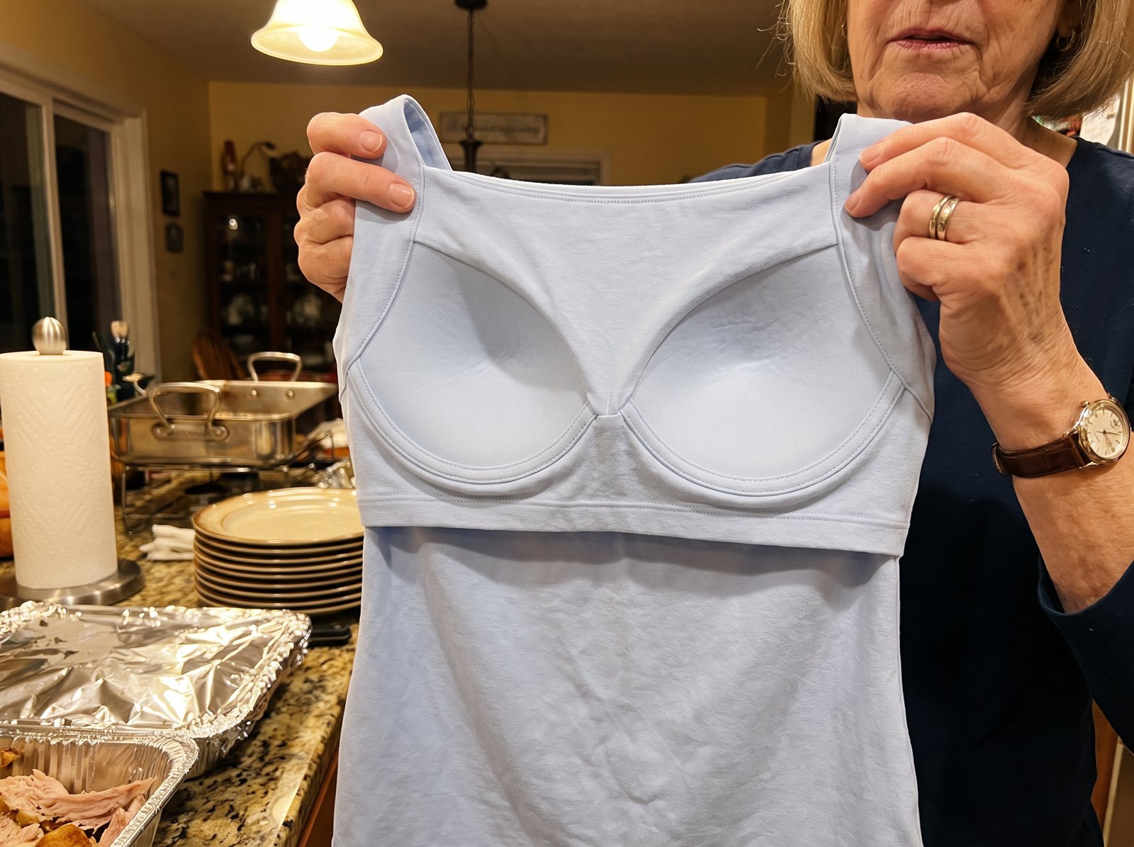 Joyce showing the shaped cups sewn inside her tank