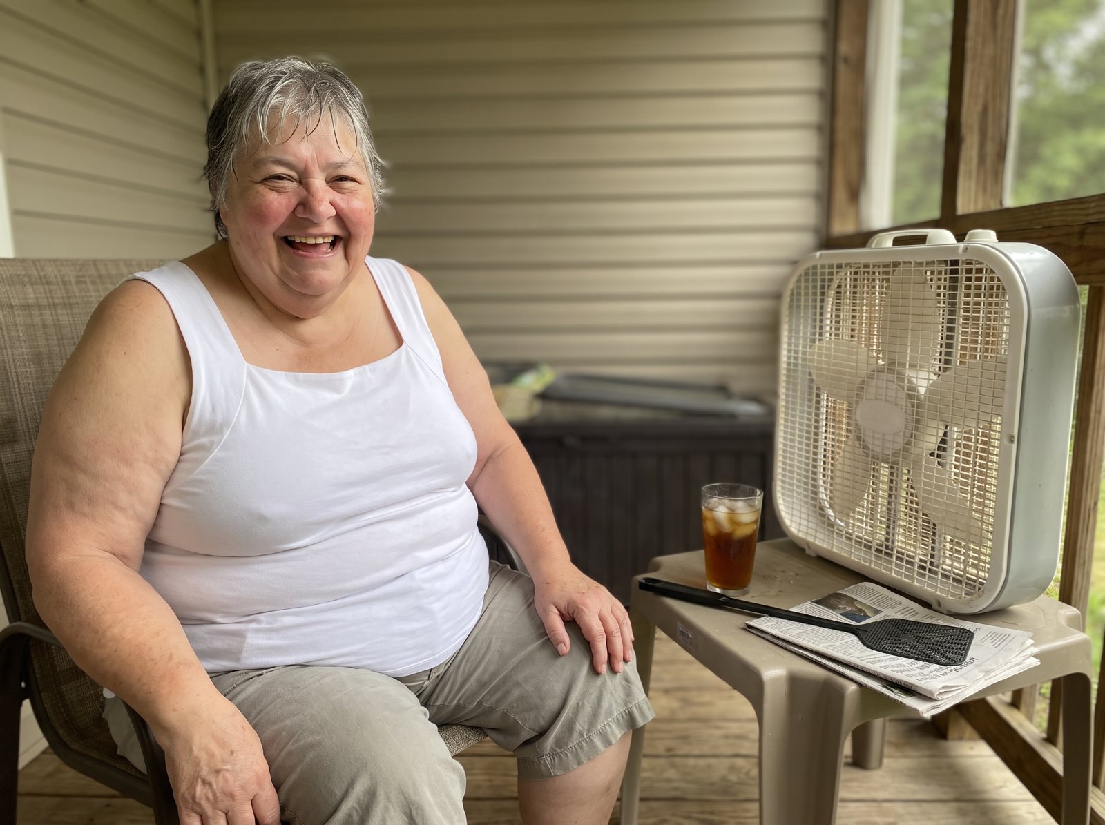 Sharon on her porch in the white tank