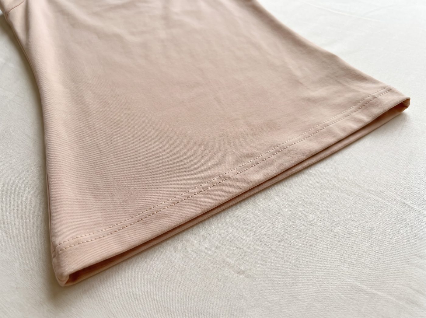 A finished double-stitched hem lying flat