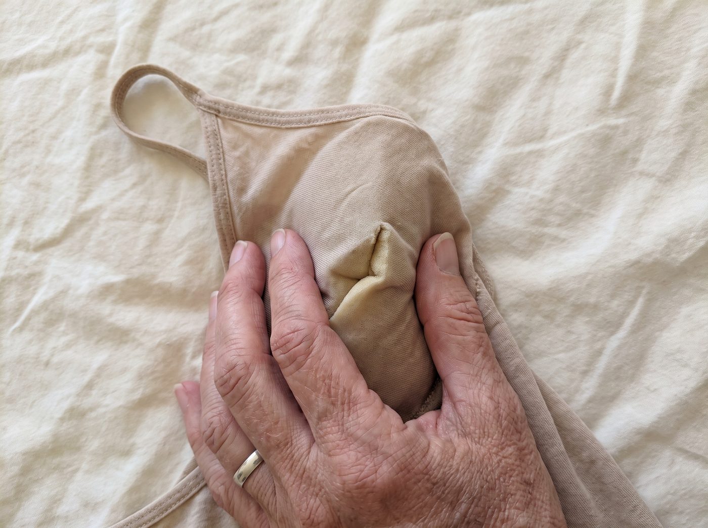 Pinching a cheap camisole: the foam pad buckles