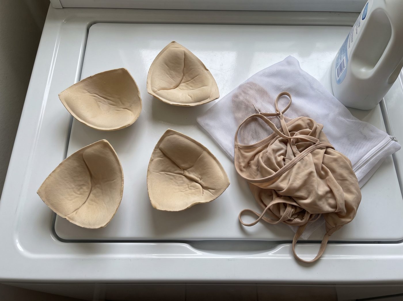 Creased loose foam pads on top of a washing machine